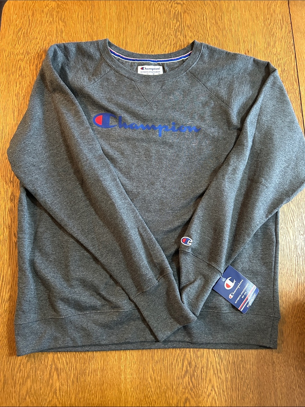Champion women’s  Charcoal Gray Crewneck with Blue & Red Logo
